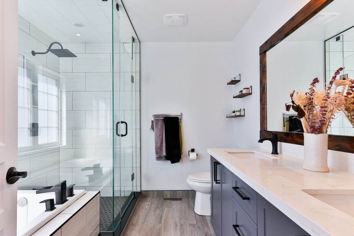 A tidy bathroom with glass shower doors