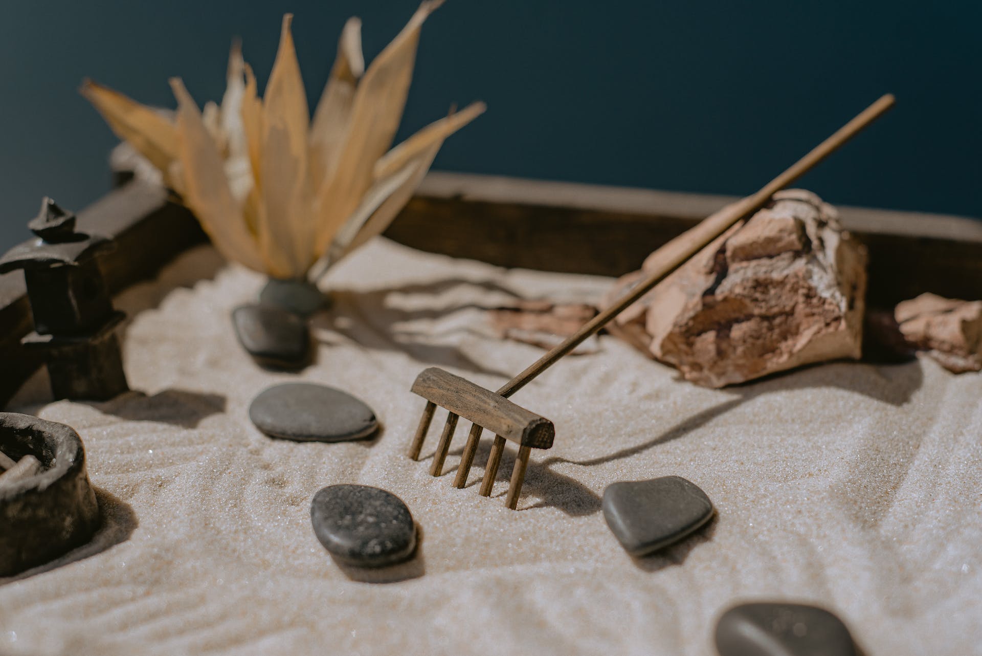 sand with pebbles and a mini rake